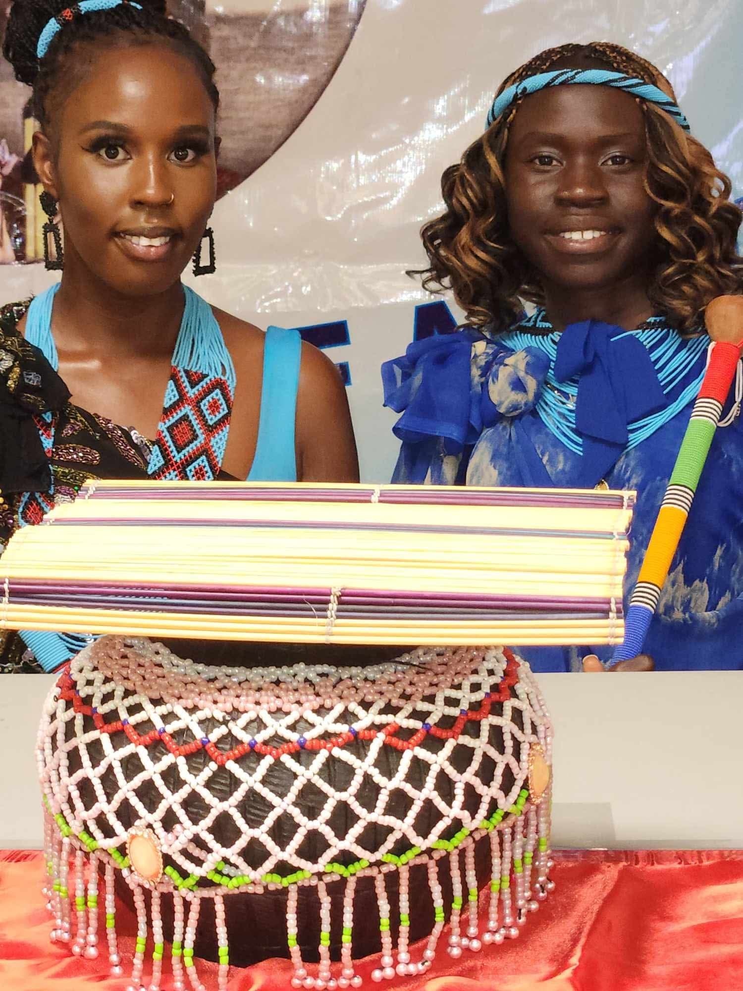 Women with cultural artifacts