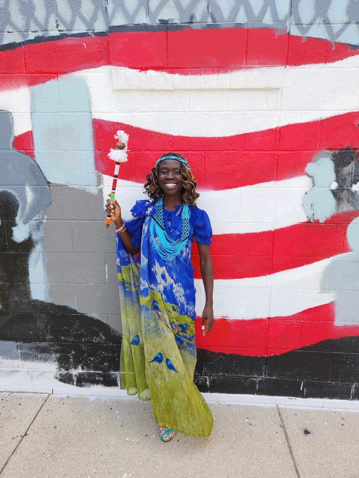 Woman by American mural